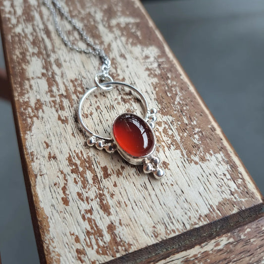 Red agate and silver pendant
